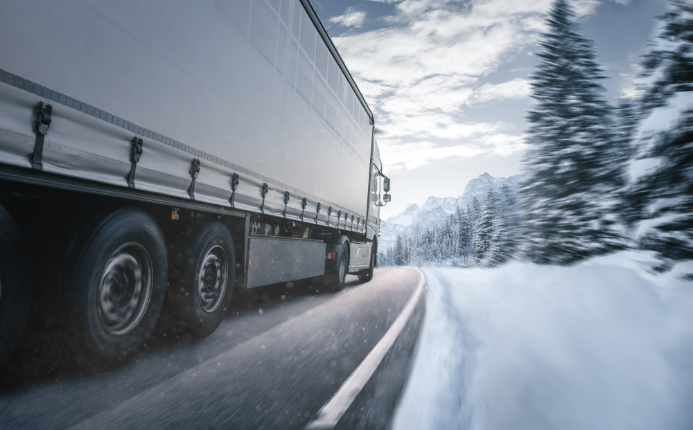 Barr-Nunn truck driving on highway in winter