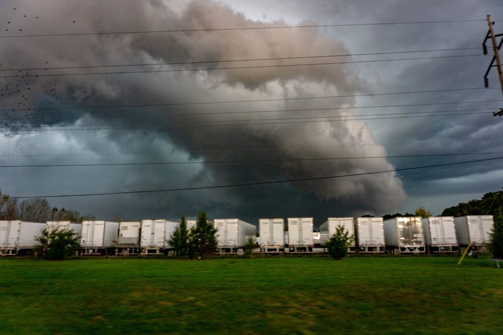 tornado forming near semi-truck yard